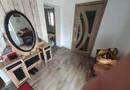 Casa individuala pe parter, cu pod foarte inalt amenajat.